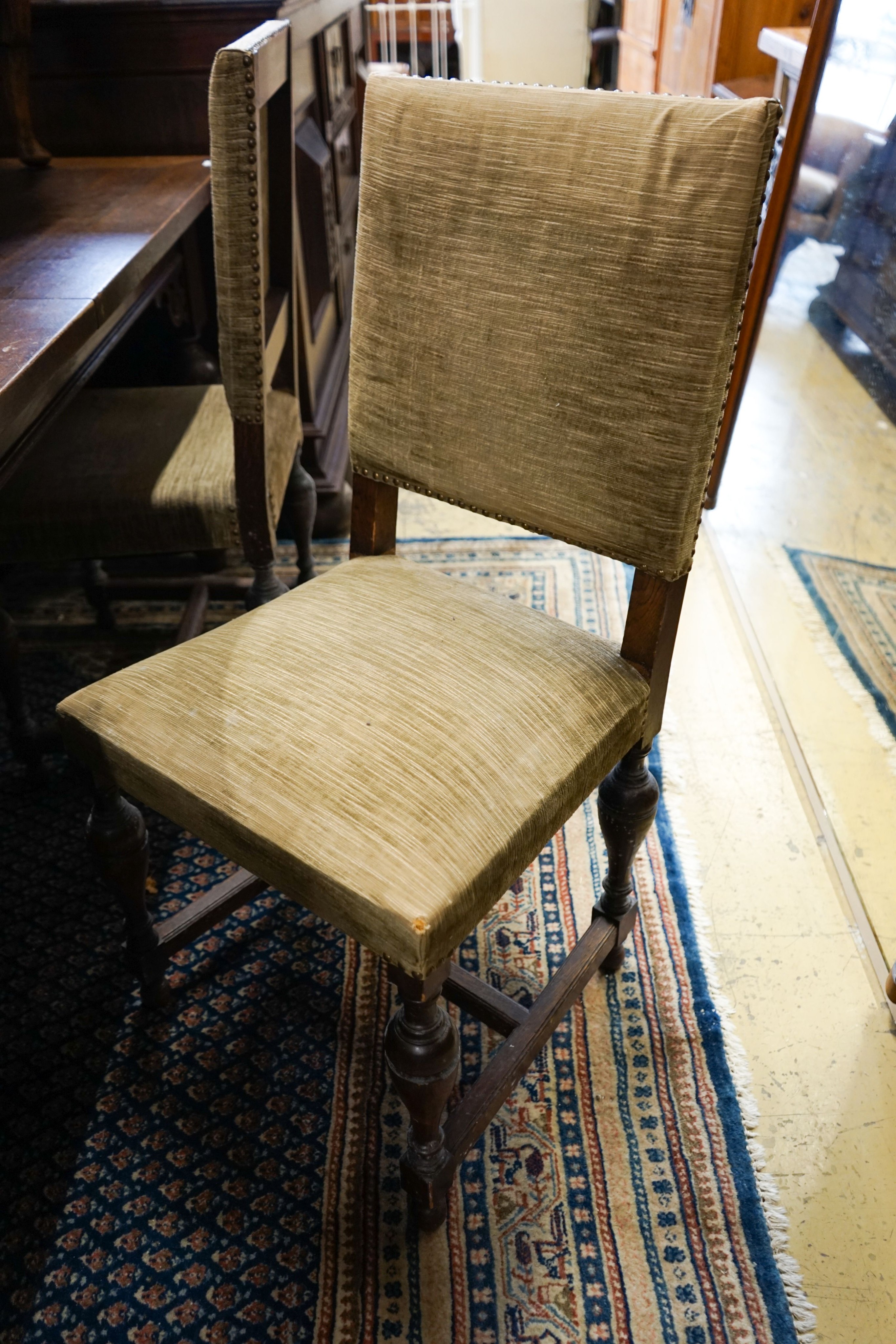 A 19th century Dutch rectangular oak extending dining table, 220cm extended, width 94cm, height 76cm on four carved bulbous supports (two additional leaves) and a set of five dining chairs